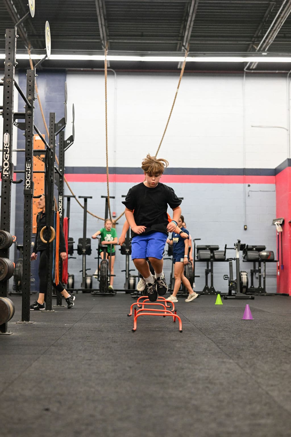 Teen athletes doing agility drills in youth fitness program at Monument Fitness Charlestown
